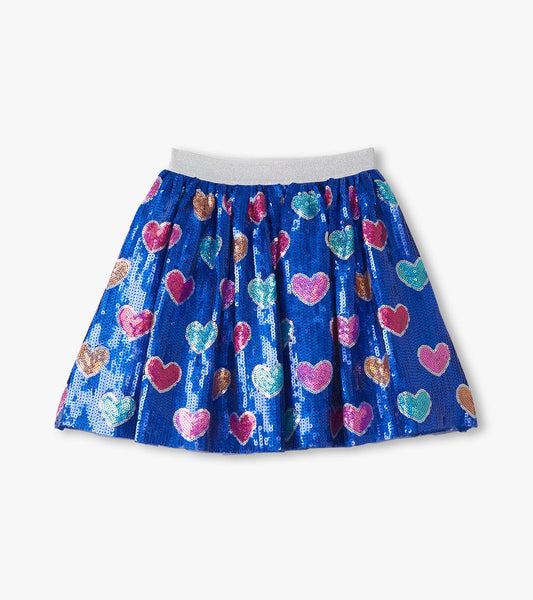 Blue sequin skirt featuring colorful heart patterns and an elastic waistband. Suitable for casual or festive wear.