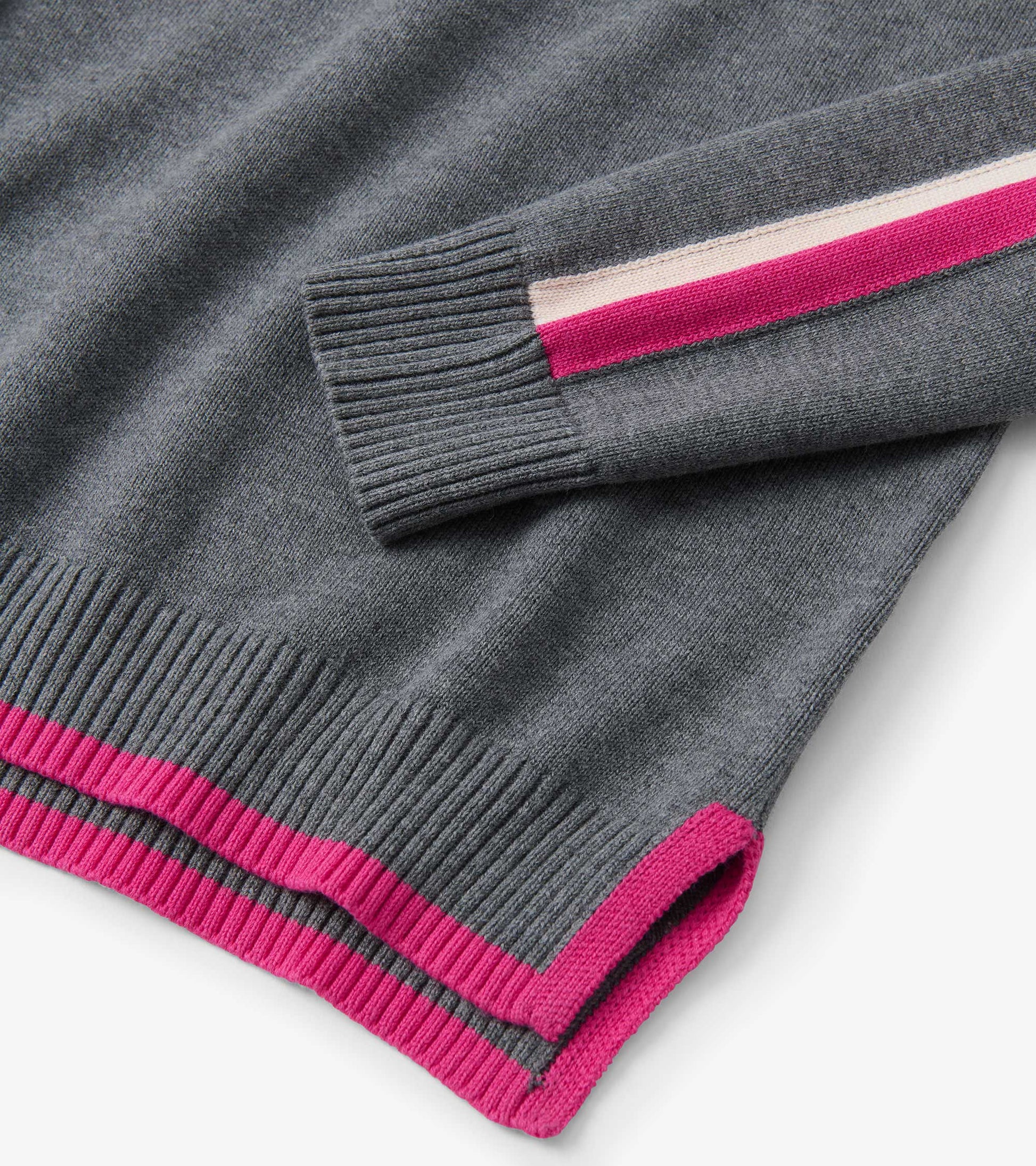 Charcoal sweater featuring ribbed cuffs and hem with contrasting pink and cream stripes.