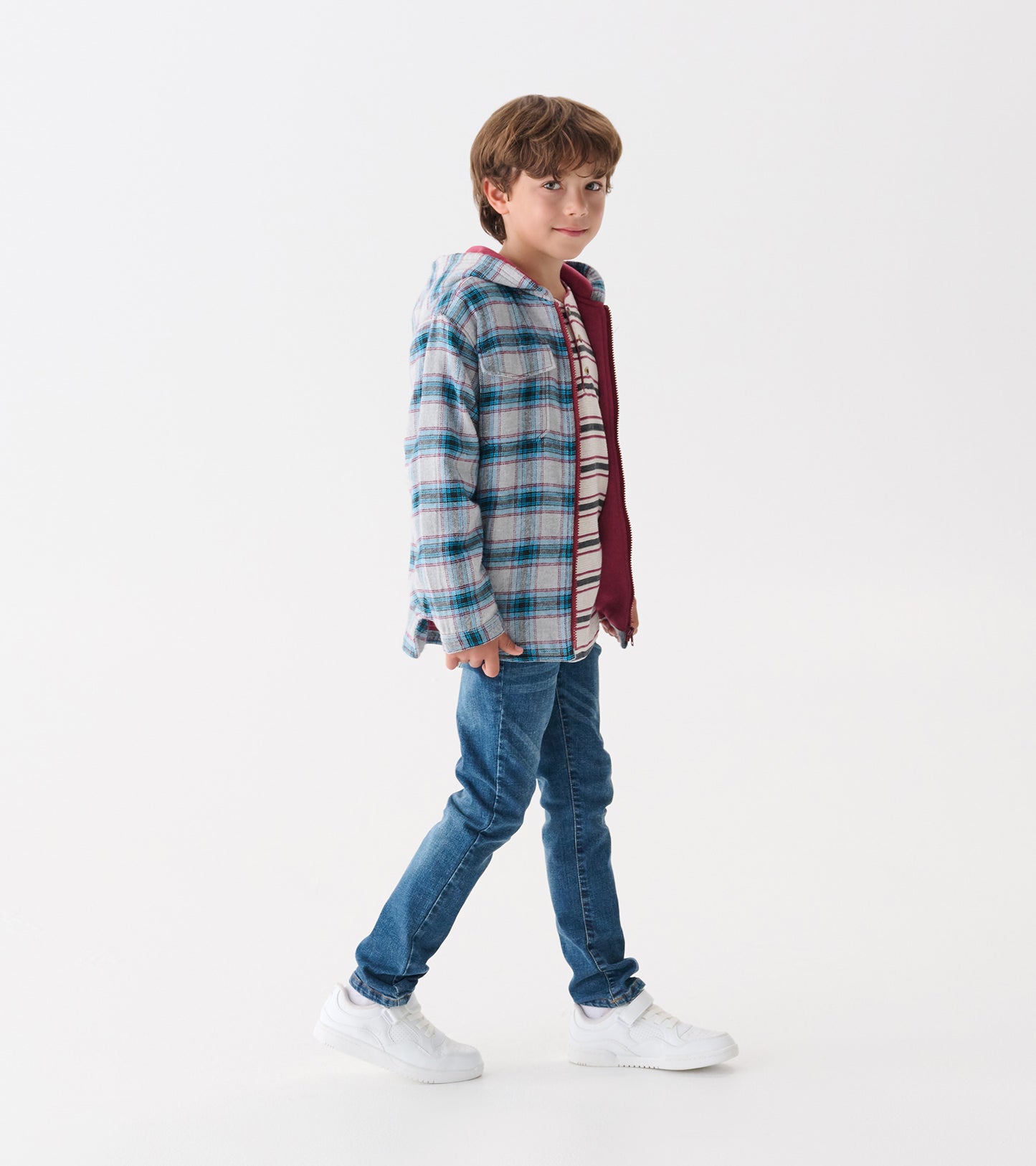 Hooded jacket in charcoal and maroon plaid, featuring a lined interior, worn by a boy with jeans and sneakers.