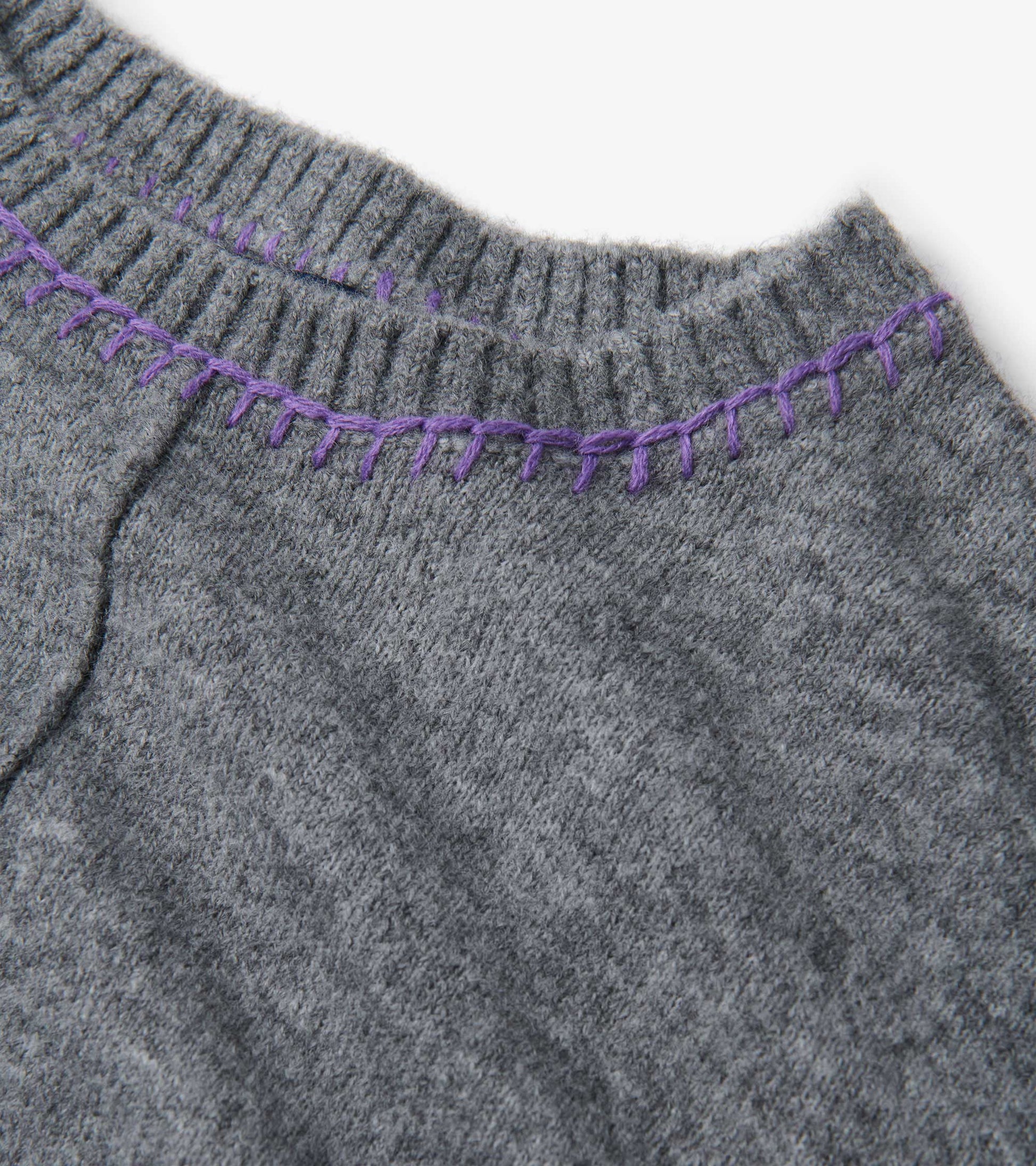 Charcoal melange sweater featuring a ribbed neckline with contrasting purple stitching.