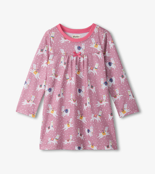 Long sleeve nightdress in pink with a playful alpaca print and polka dots, featuring a gathered bodice and bow detail.