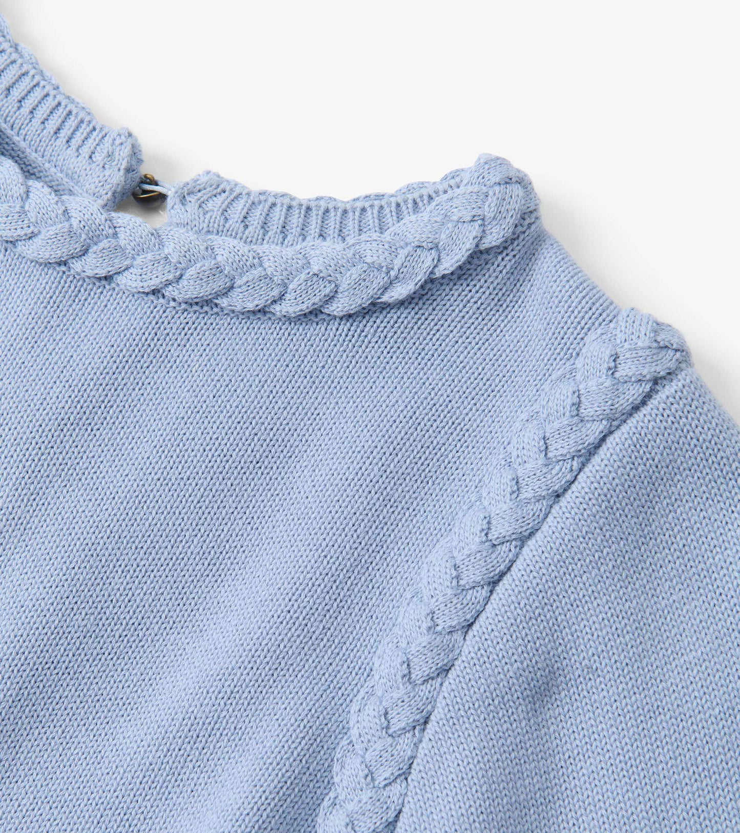 Light blue braided knit sweater with ribbed collar and diagonal cable trim, close-up front view