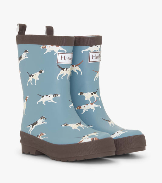 Matte blue rain boots featuring playful dog patterns and brown soles, designed for boys.