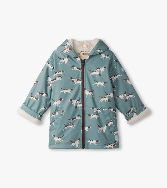 Light blue zip-up rain jacket with a Sherpa lining, featuring a playful dog print and a hood.