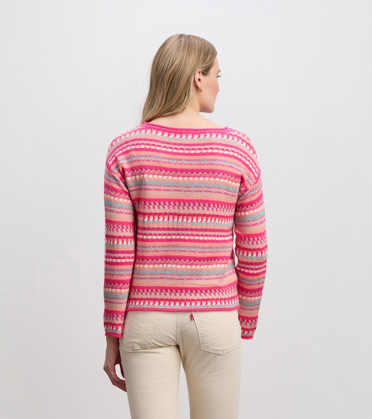 Colorful striped sweater featuring pink, red, and gray patterns, with a relaxed fit and round neckline, viewed from the back.