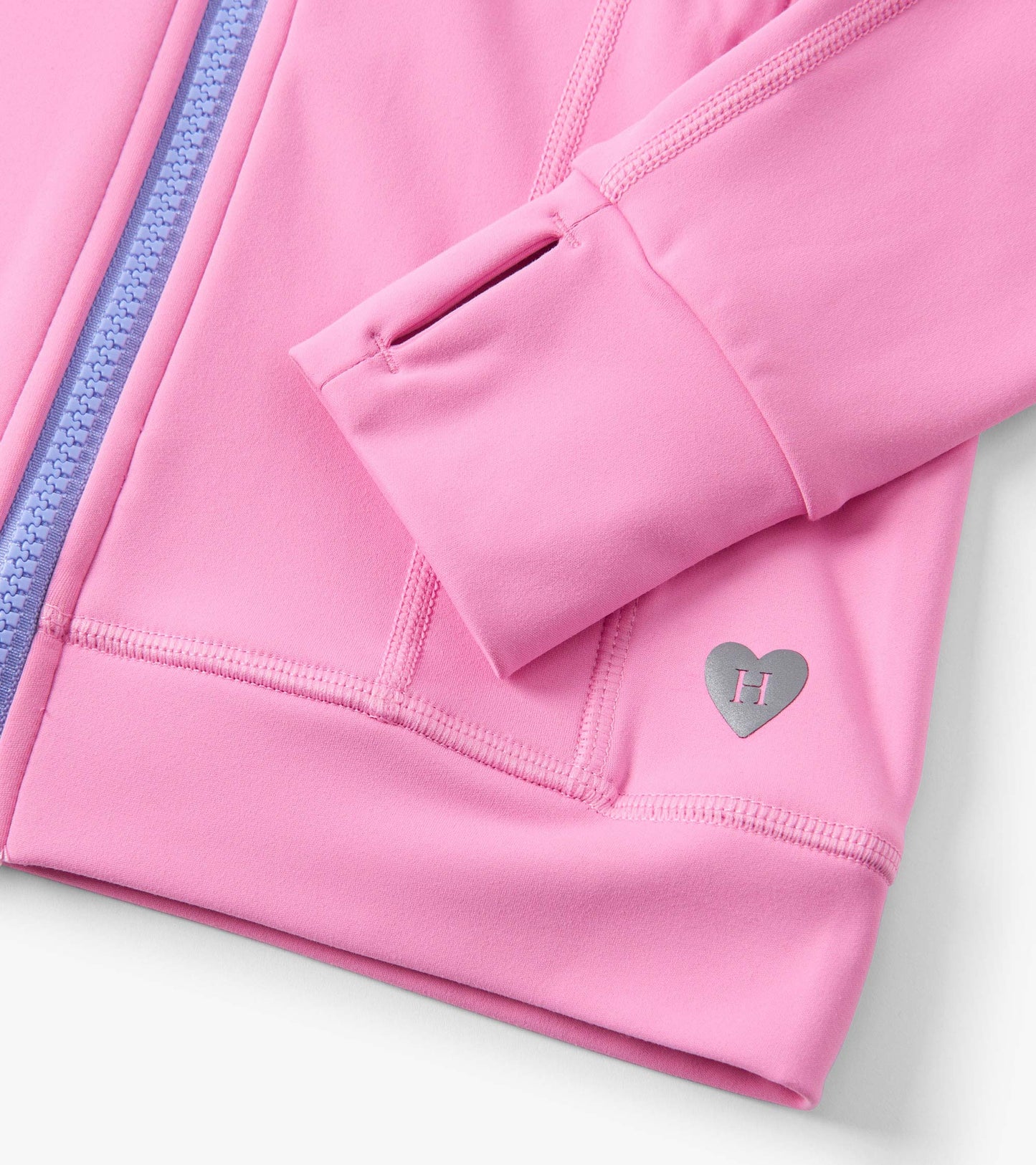 Fuchsia pink active jacket with a zip front, purple accents, and a heart logo detail on the sleeve.