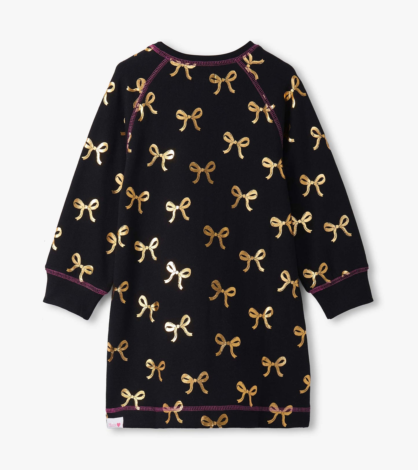 Black sweater dress featuring gold bow patterns and long sleeves, with a round neckline and purple stitching details.