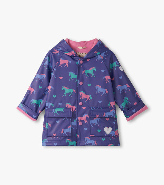 Purple rain jacket featuring colorful unicorns and hearts, with a pink lining and button-up front. Suitable for toddlers.