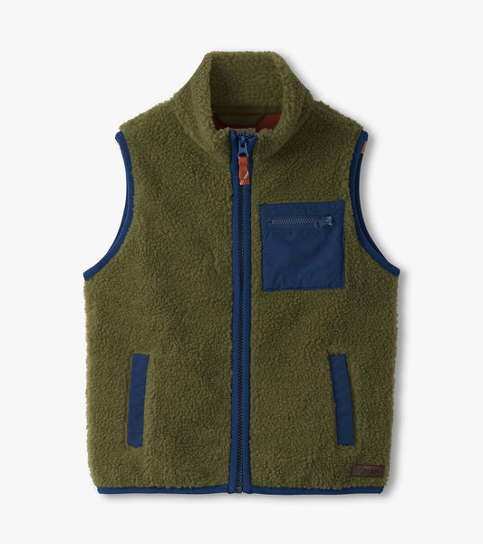 Loden green faux sherpa vest with a zip front, high collar, and a navy pocket detail. Suitable for boys.