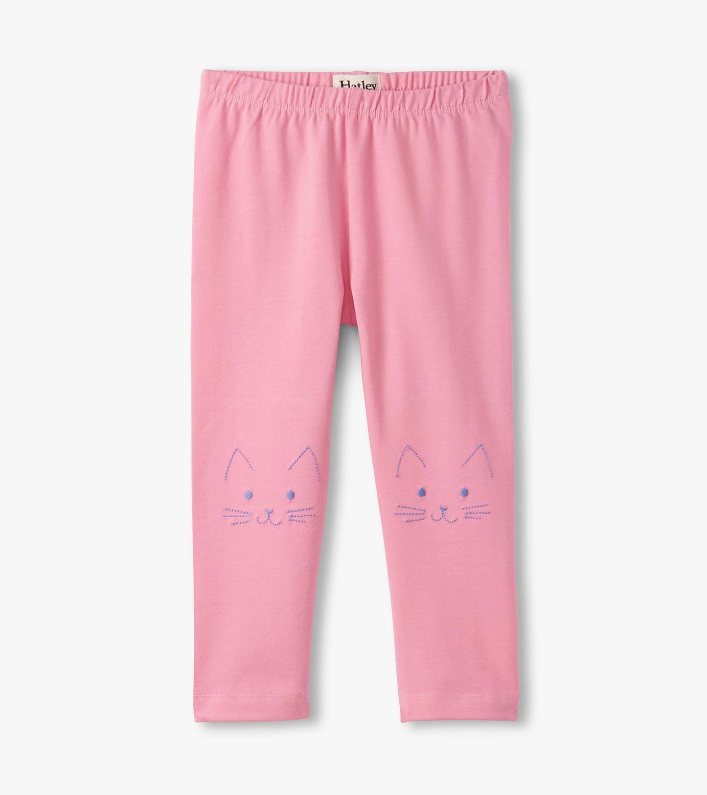 Pink leggings featuring cute cat face designs on the front, made from soft, stretchy material for comfort.