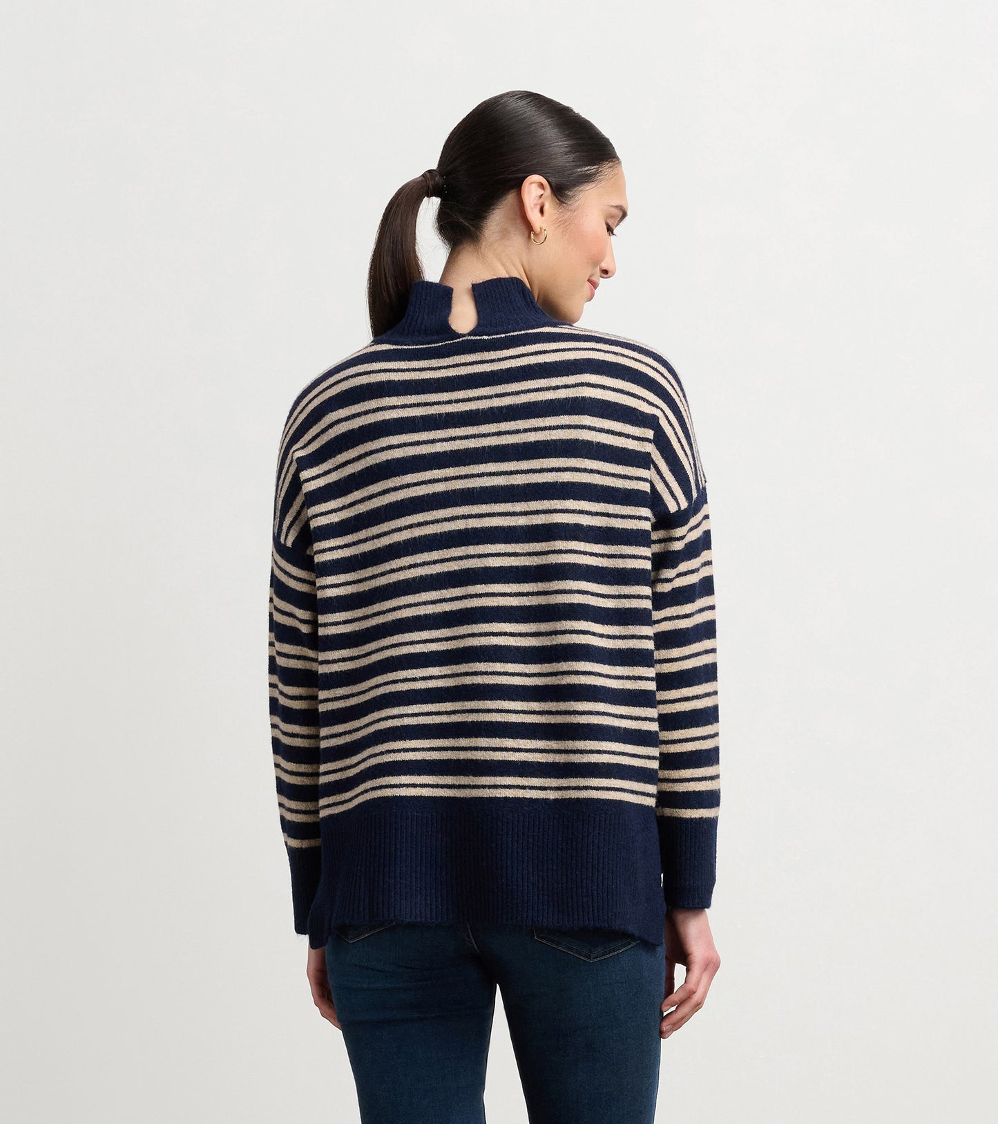 Navy and camel striped mock neck sweater with a relaxed fit and back keyhole detail.