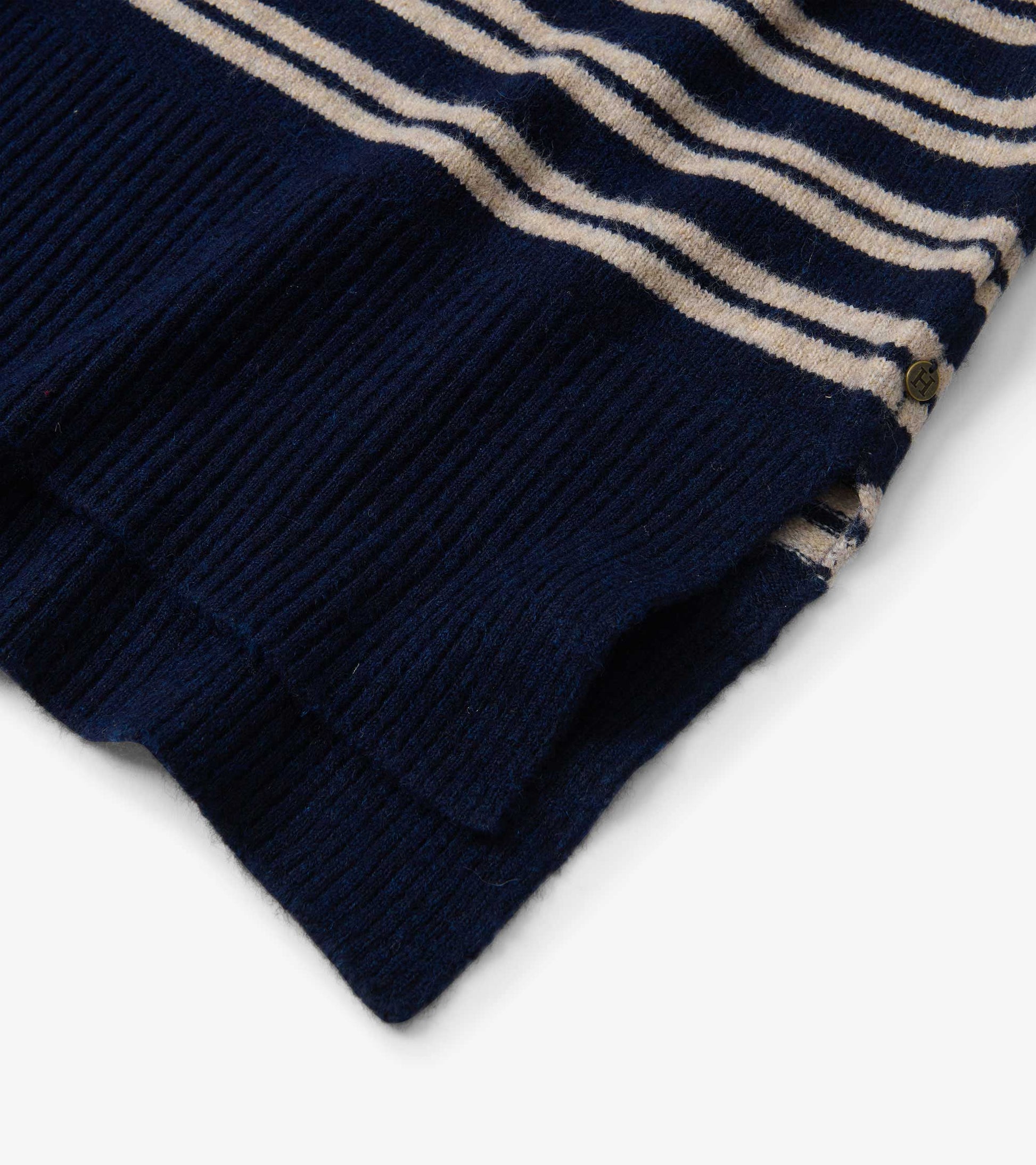 Navy sweater with camel stripes, featuring a mock neck and ribbed hem, shown from a folded view.