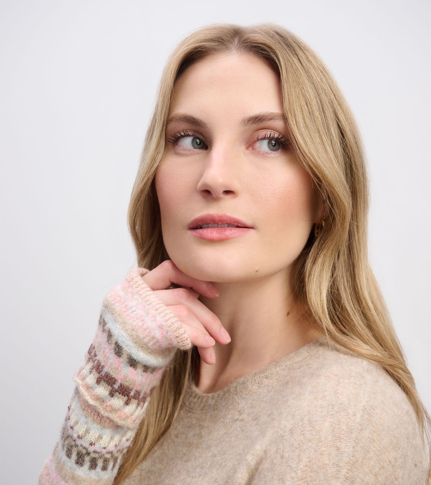 Oatmeal melange sweater dress with patterned sleeves, featuring soft knit material and a relaxed fit.
