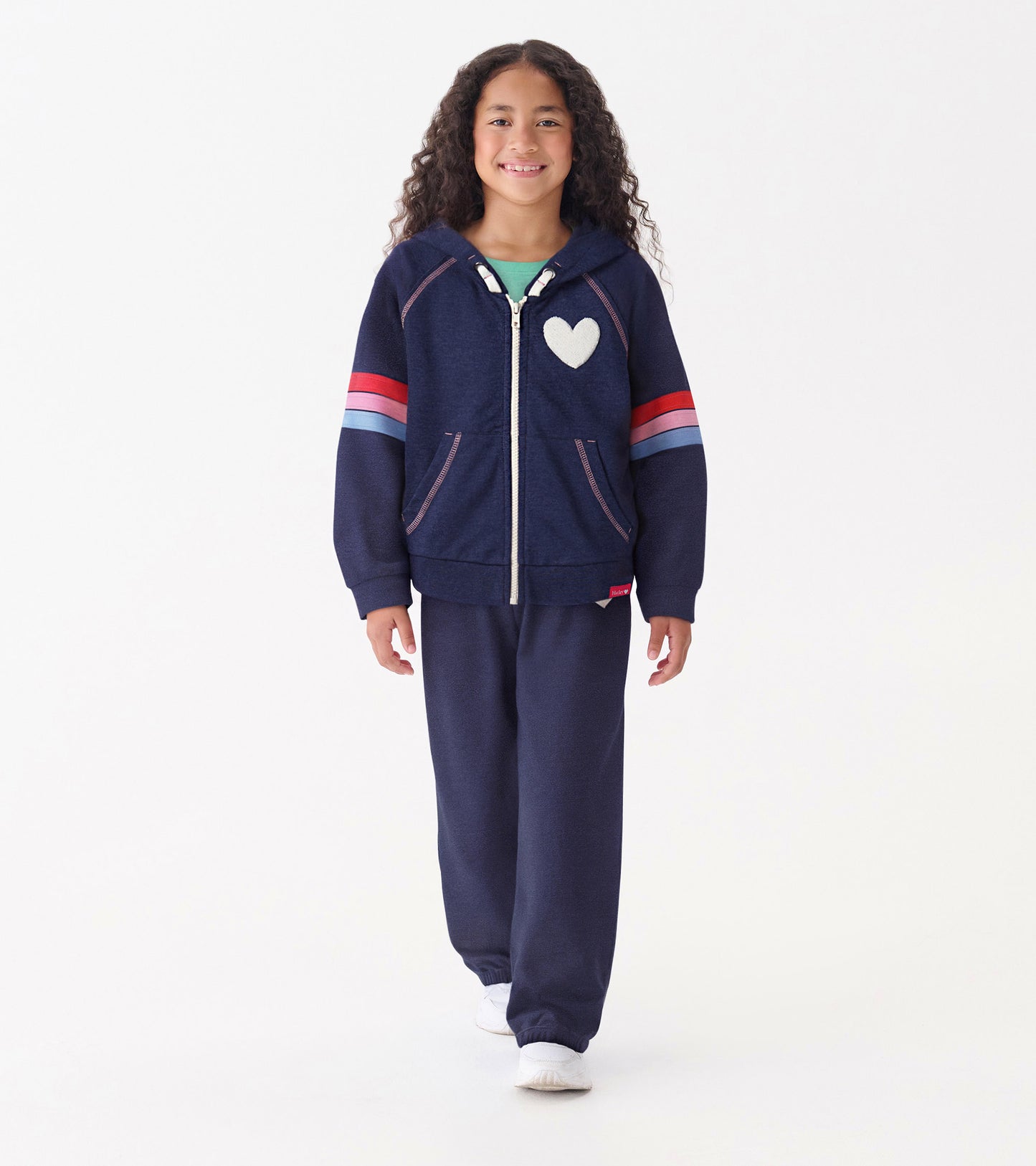 Patriot blue zip-up hoodie with a heart design, featuring striped sleeves, worn by a girl with curly hair.