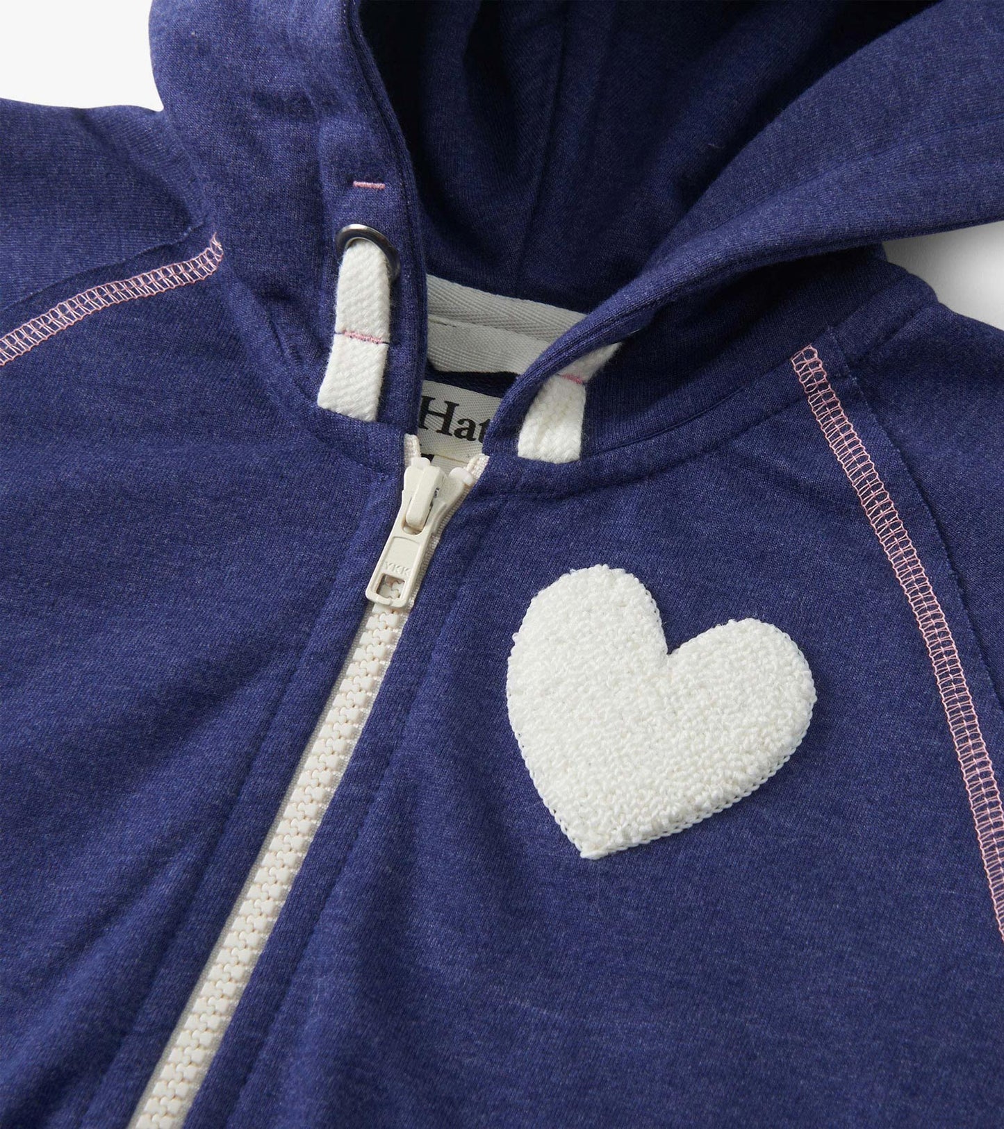 Patriot blue zip-up hoodie featuring a white heart patch and contrasting pink stitching. Ideal for casual wear.