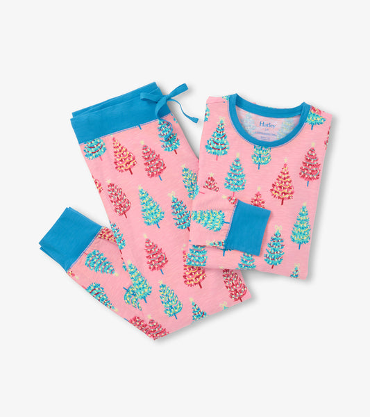 Pink cotton pajama set featuring colorful bottle brush tree patterns, with blue accents on the cuffs and waistband.