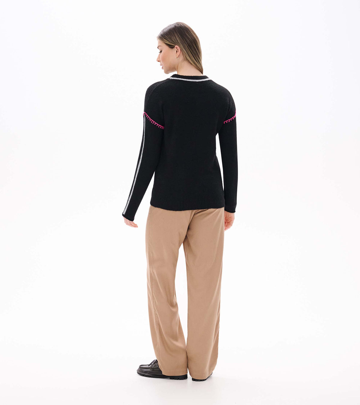 Back view of Maeve sweater in black with grey sleeve stripes and pink trim at the upper arms