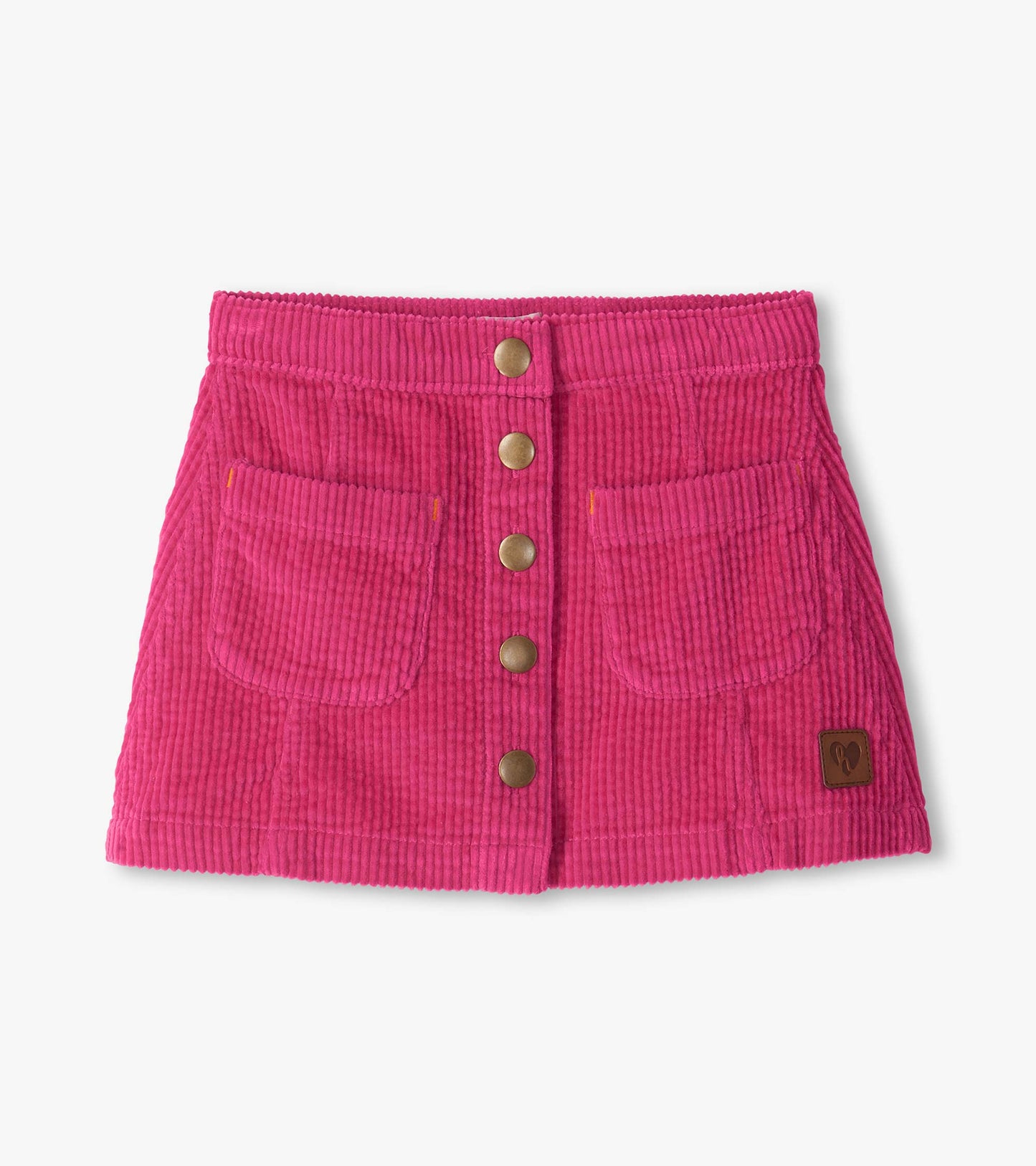 Pink A-line skirt with ribbed texture, front snap buttons, front pockets, and a small logo patch near the hem