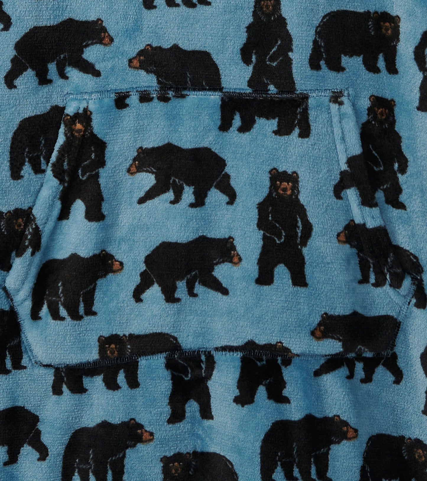 Oversized fleece hoodie in blue with a black bear pattern and a front pocket.