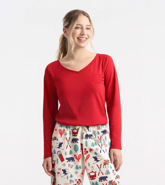 Red long sleeve t-shirt with a v-neck and a small pocket, paired with patterned pajama pants.