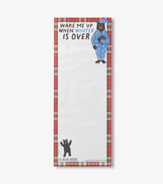 Magnetic notepad with a bear in pajamas, blue and white stars, and a red plaid border, featuring a winter-themed message.