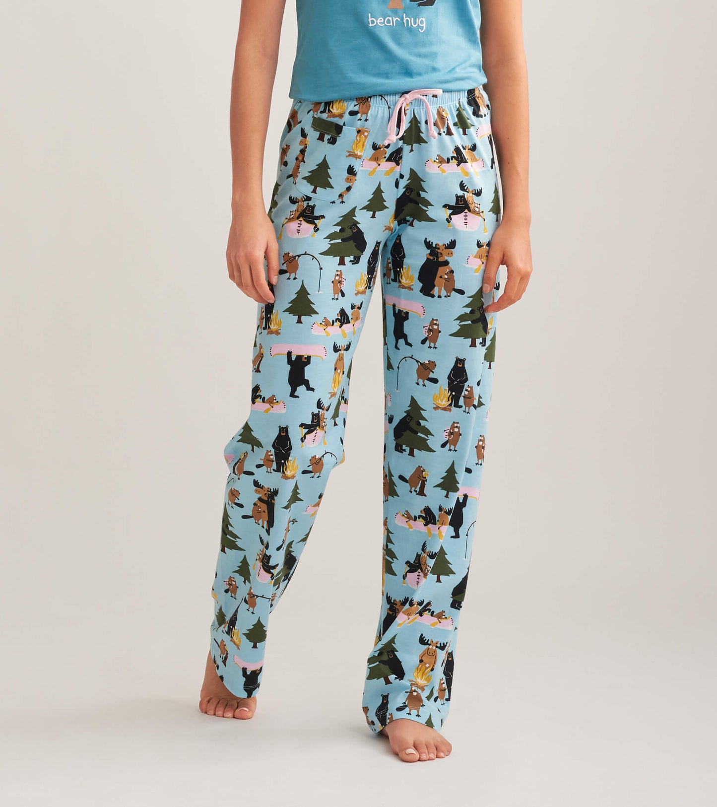 Light blue cotton pajama pants featuring a playful forest animal print, ideal for lounging or sleeping.