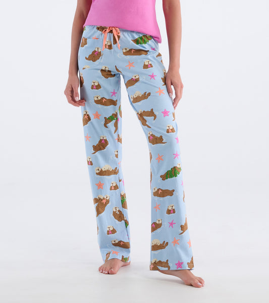 Light blue cotton pajama pants featuring a playful otter pattern with stars and tropical leaves, designed for comfort.