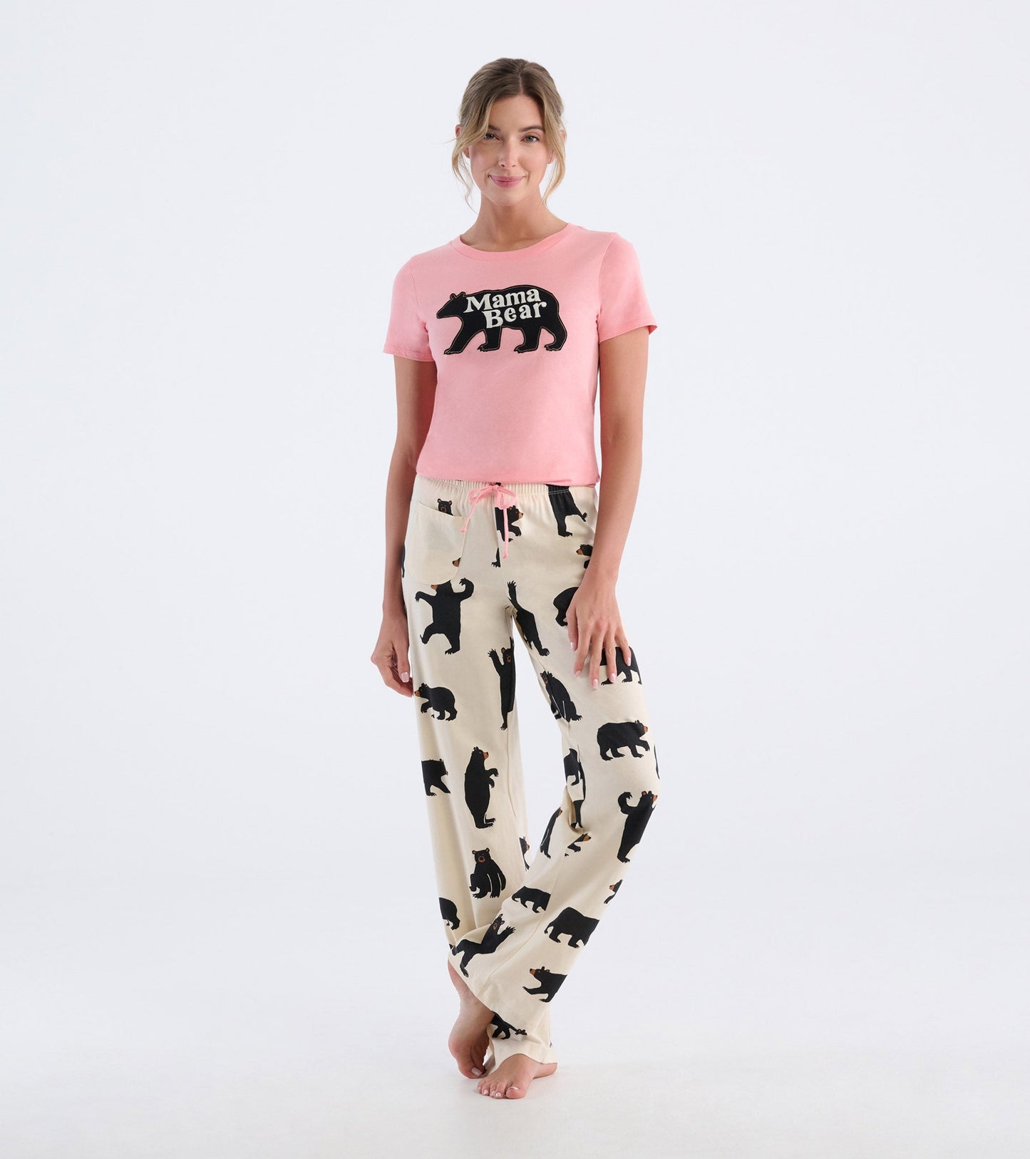 Black cotton pajama pants featuring a playful bear pattern, paired with a pink short-sleeve top.