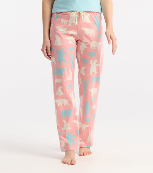 Pink cotton pajama pants featuring a playful polar bear pattern in white and light blue, with an elastic waistband and draws…