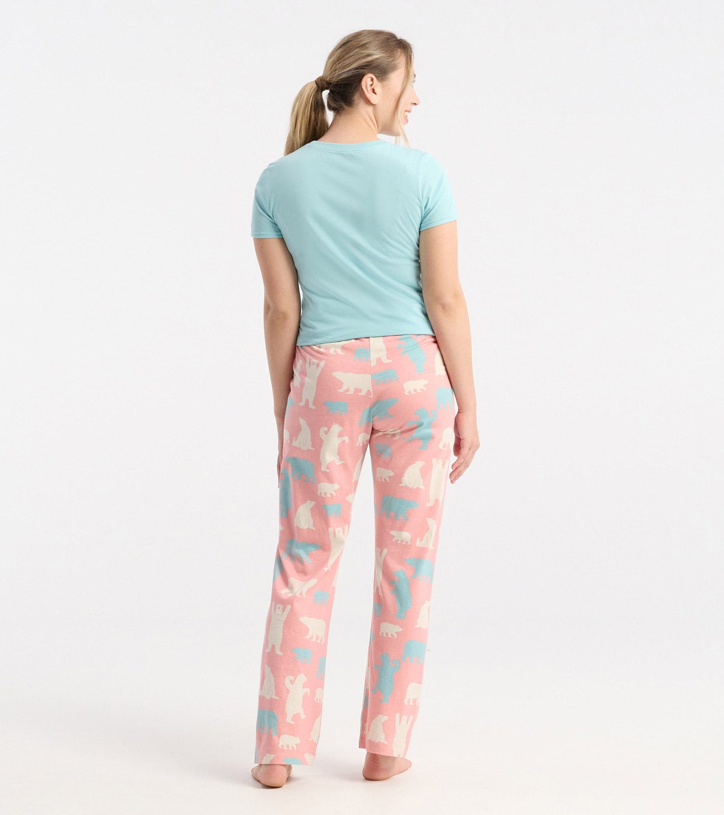 Women's cotton pajama pants in pink with polar bear patterns, featuring a relaxed fit and elastic waistband.
