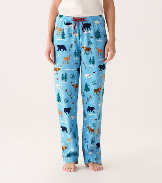 Light blue cotton pajama pants featuring a winter wildlife print with bears, deer, and trees, styled with a red drawstring.