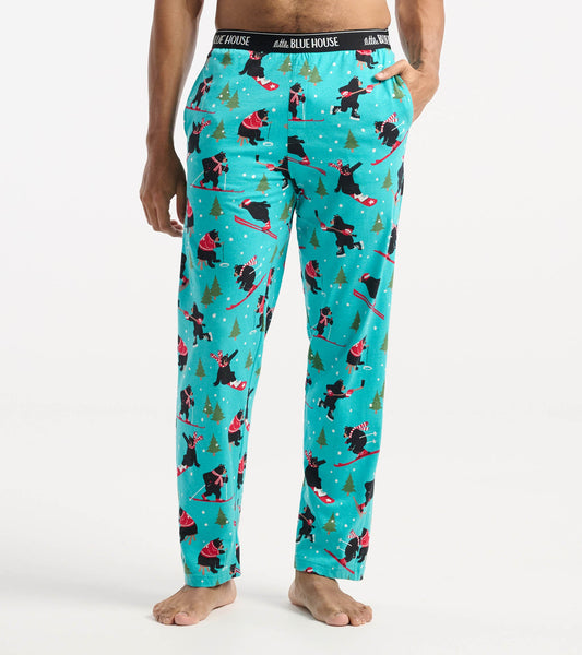 Turquoise cotton pajama pants featuring a playful winter sports bear pattern, ideal for cozy lounging.