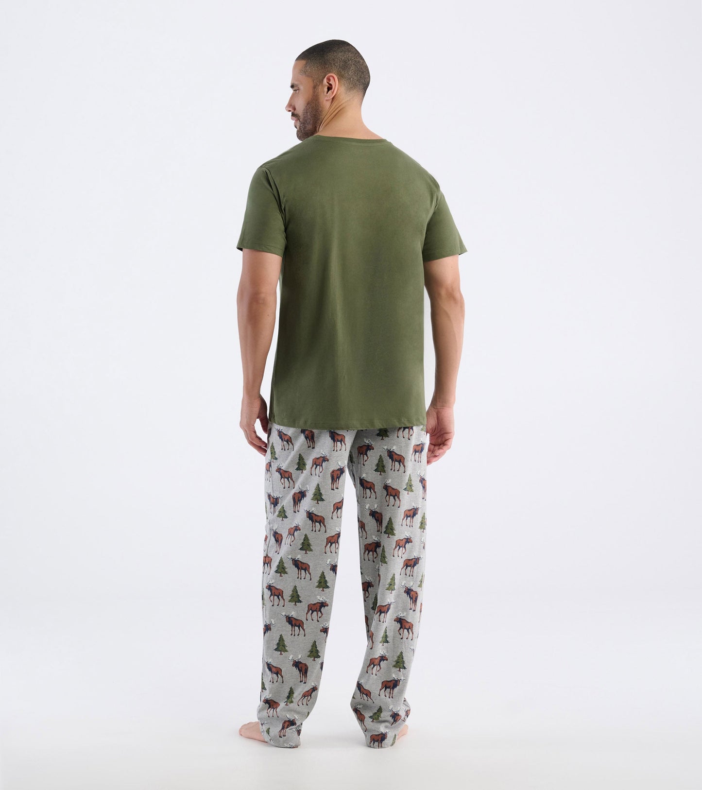Men's pajama pants in gray cotton blend featuring moose and pine tree pattern, relaxed fit, and elastic waistband.
