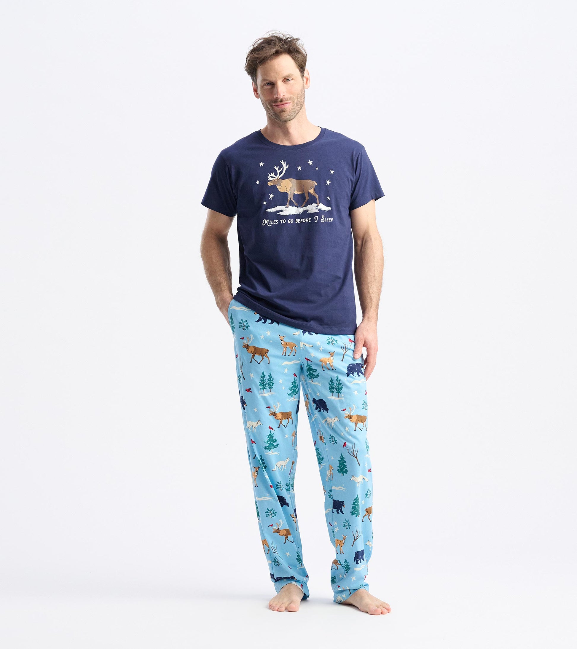 Light blue pajama pants featuring a winter animal print, including deer and trees, perfect for cozy nights.