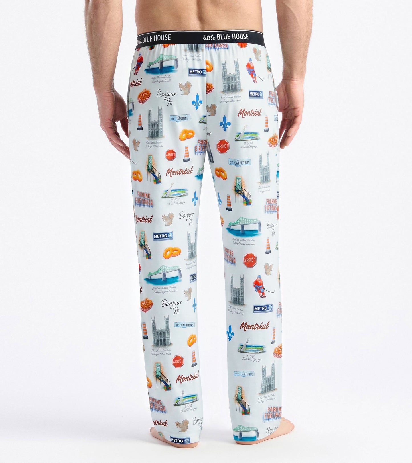 Back view of men's white pajama pants with Montreal print and black Little Blue House waistband