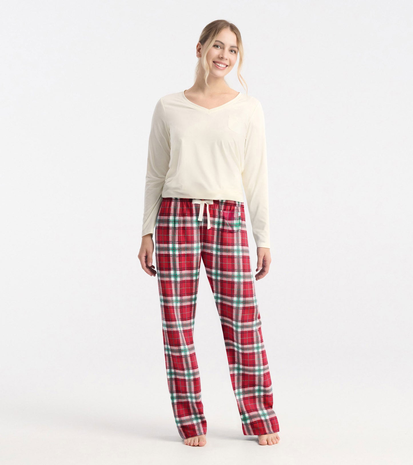Red plaid polyknit pajama pants with an elastic waistband and drawstring, styled for a relaxed fit.