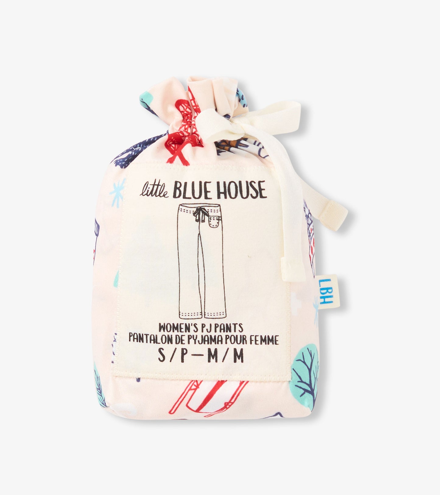 Drawstring pouch containing women's pajama pants with a colorful ski-themed print.
