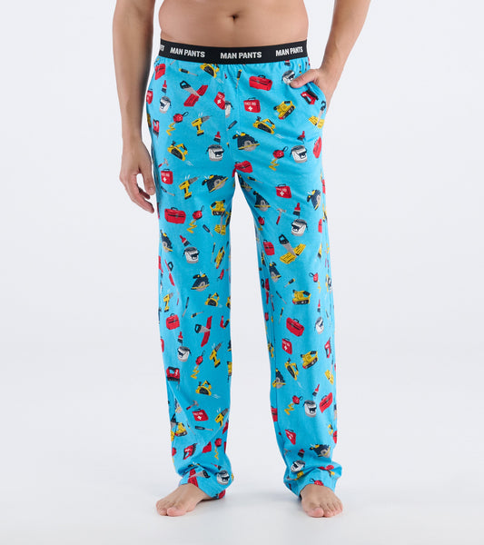 Light blue pajama pants featuring a colorful handyman-themed print, with an elastic waistband and side pockets.
