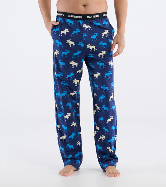 Navy pajama pants featuring a playful moose pattern in blue and cream, with an elastic waistband labeled "MAN PANTS.
