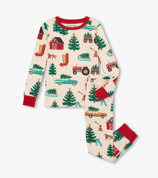 Cream pajama set featuring festive Christmas tree farm patterns, with red cuffs and accents.