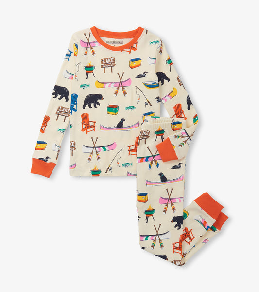 Kids' pajama set featuring a cream base with colorful lake-themed prints, orange cuffs, and a cozy fit.