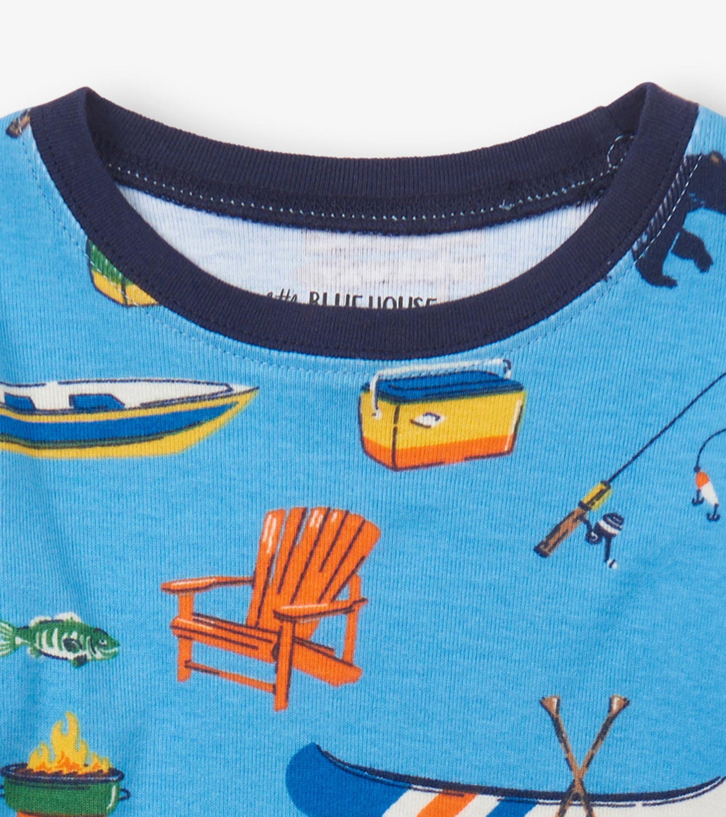 Blue pajama set featuring playful lake-themed graphics, including boats, fish, and an Adirondack chair, with a navy neckline.