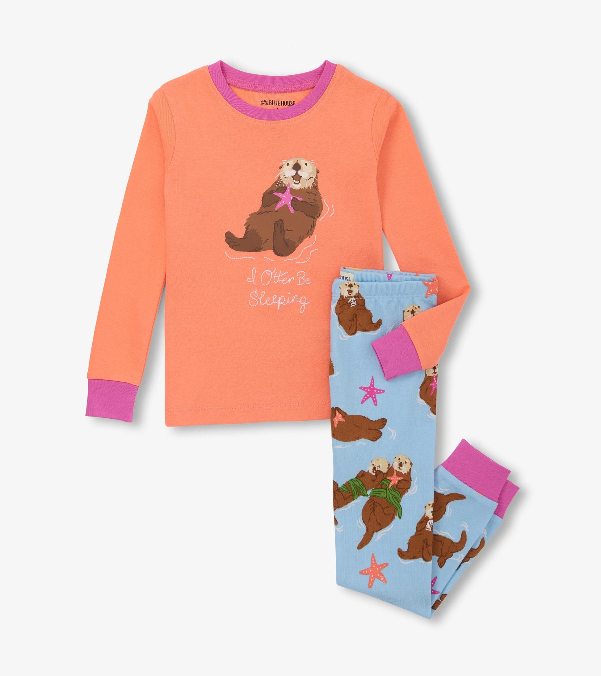 Orange long-sleeve top with otter graphic and blue pajama pants featuring otters and starfish pattern.