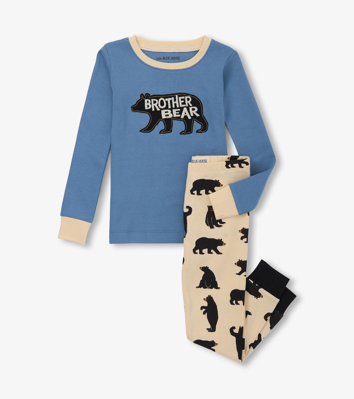 Blue long-sleeve pajama top with bear graphic paired with cream pants featuring black bear silhouettes.