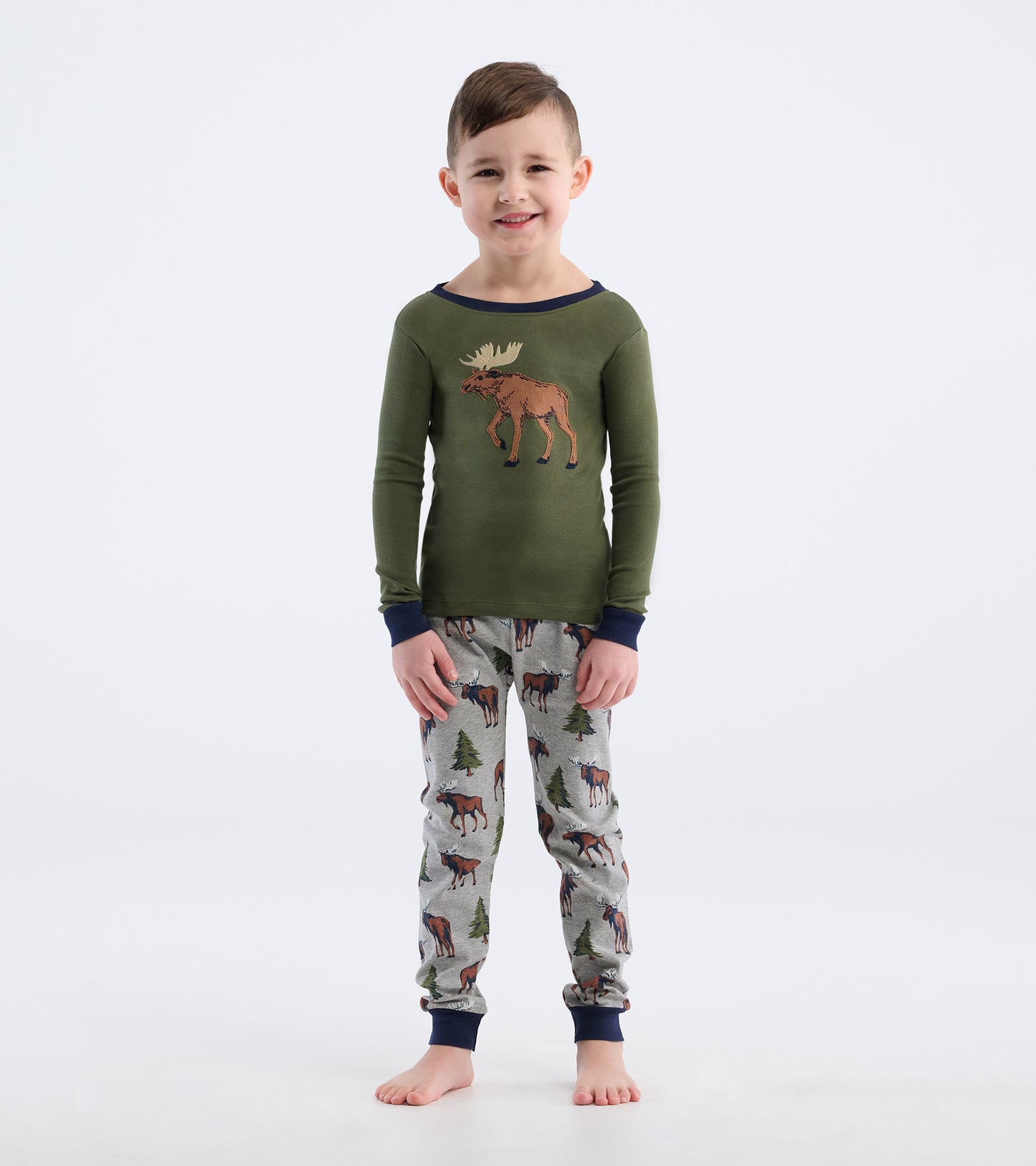 Green long-sleeve top with moose graphic, paired with gray pajama pants featuring moose and trees pattern.