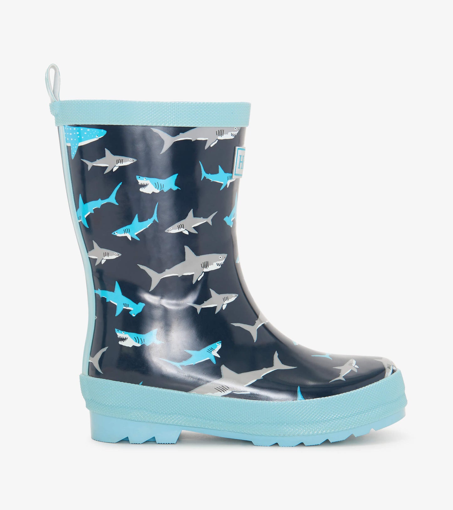 Navy rain boots featuring a shark pattern in blue and gray, with a light blue sole and trim.