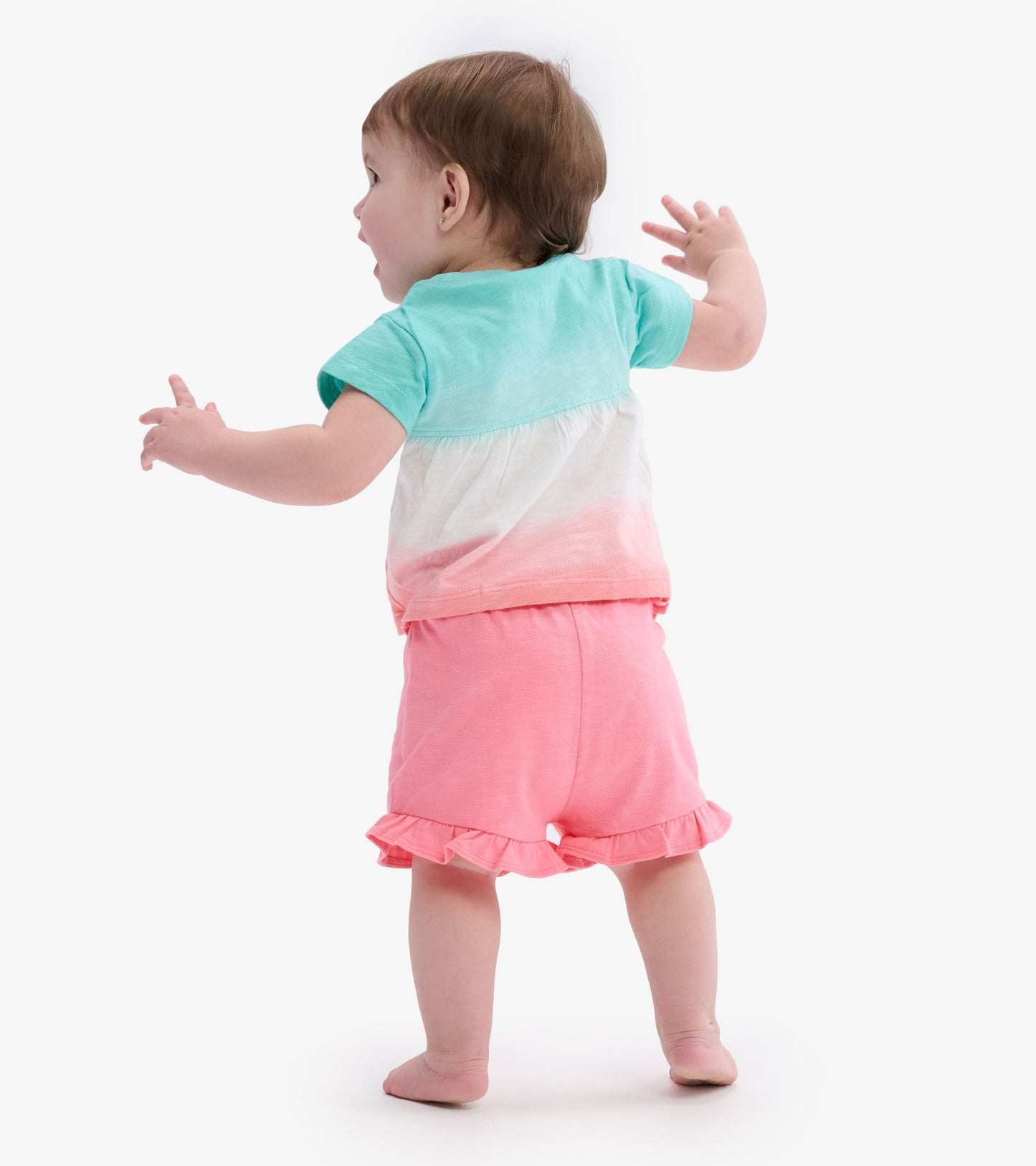 Pink ruffle shorts for baby girls, featuring a soft fabric and a playful design, shown from the back.
