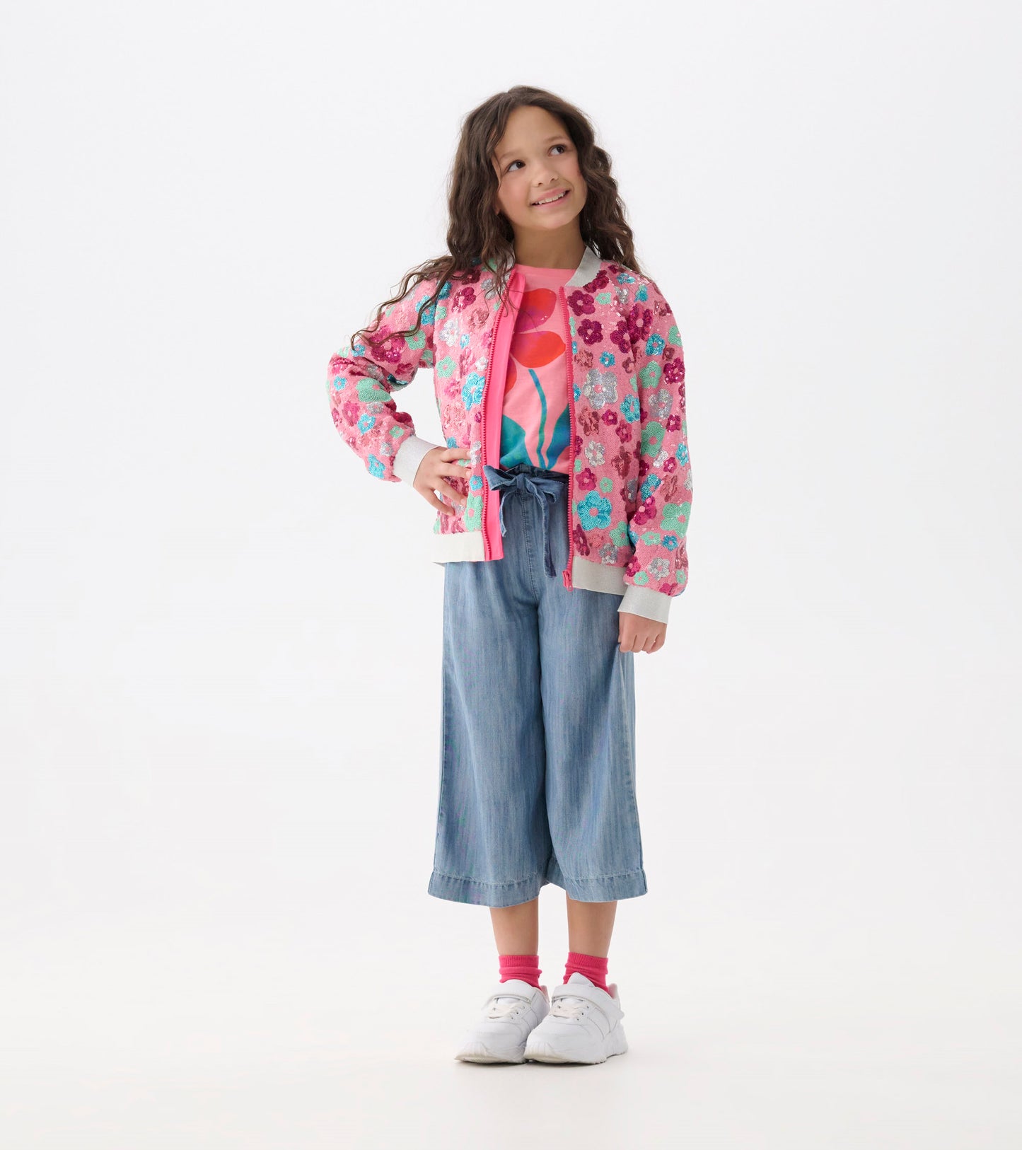 Girls smokey blue wash cropped paperbag pants with wide legs and tied waist, front view on model