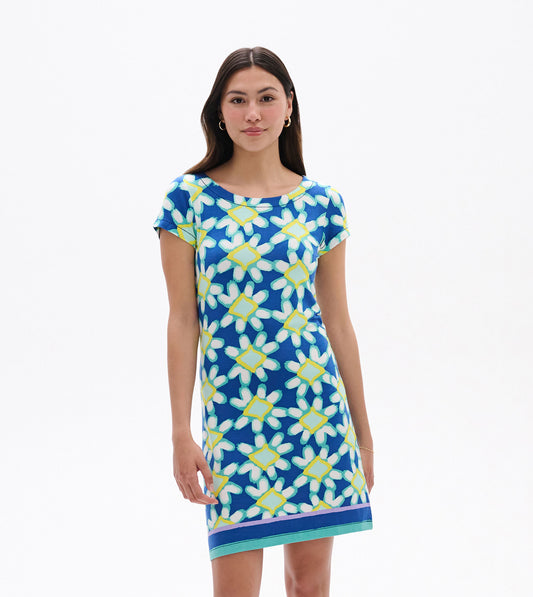 Short-sleeve dress featuring a blue shibori floral pattern with yellow and white accents, knee-length with a colorful hem.