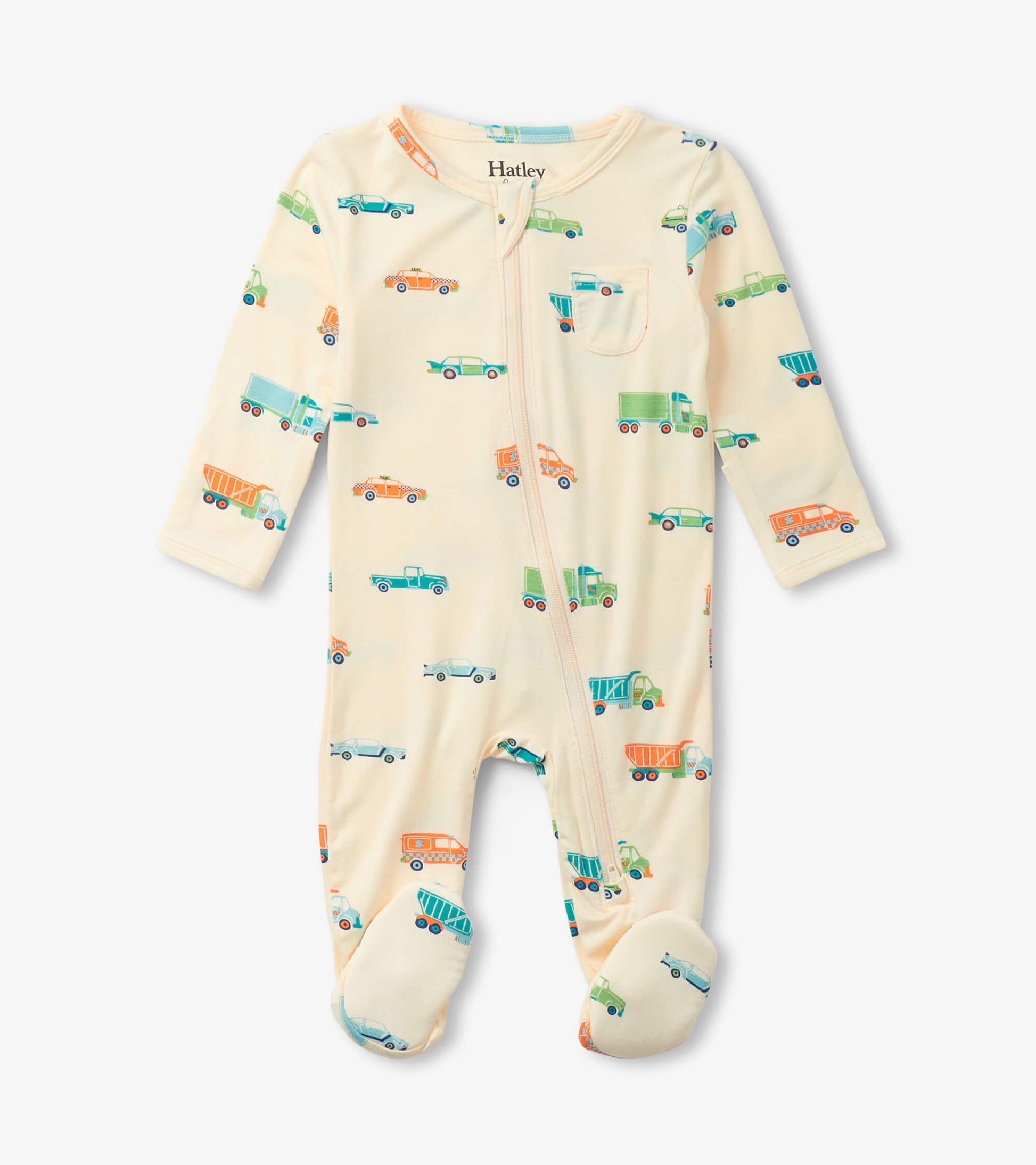 Cream footed sleeper featuring colorful truck and car patterns, with a front zipper and long sleeves.